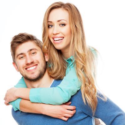 Boyfriend and girlfriend smiling at dentist office in Eagan MN