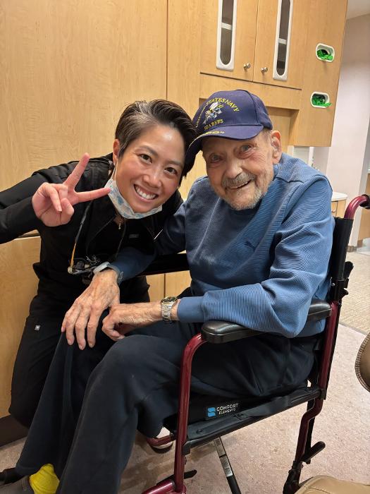 Dr. Le smiles with patient at Eagan dental office