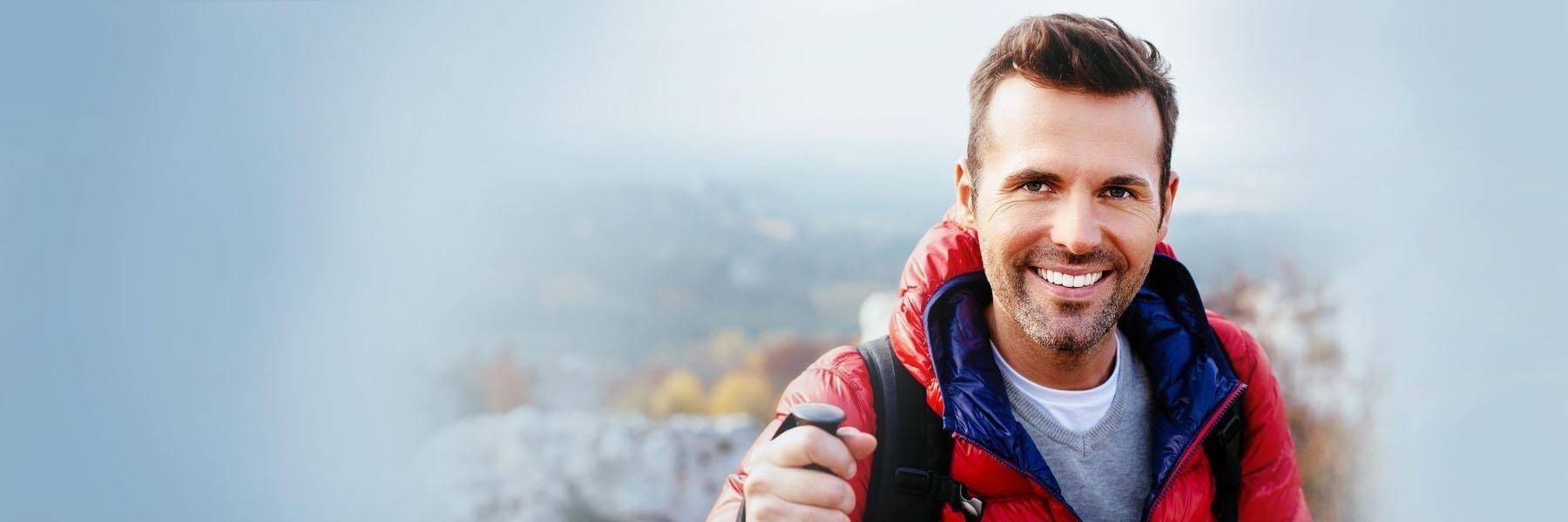 Man smiling on a hike in Eagan MN