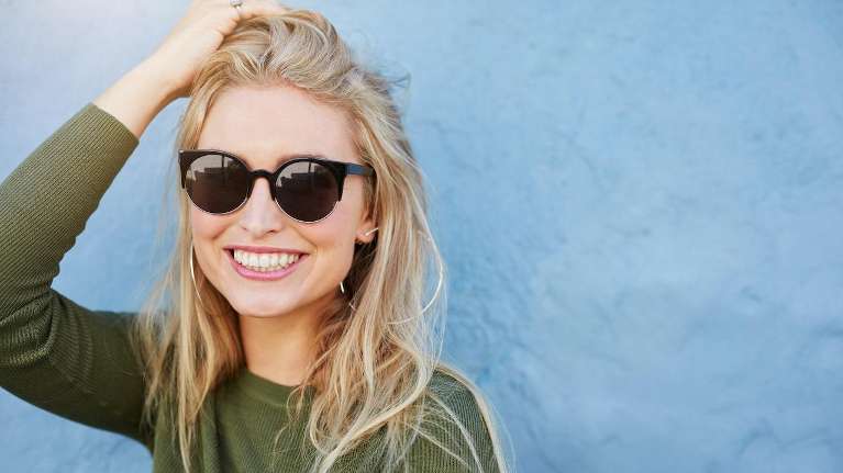Blonde woman with veneers in Eager MN
