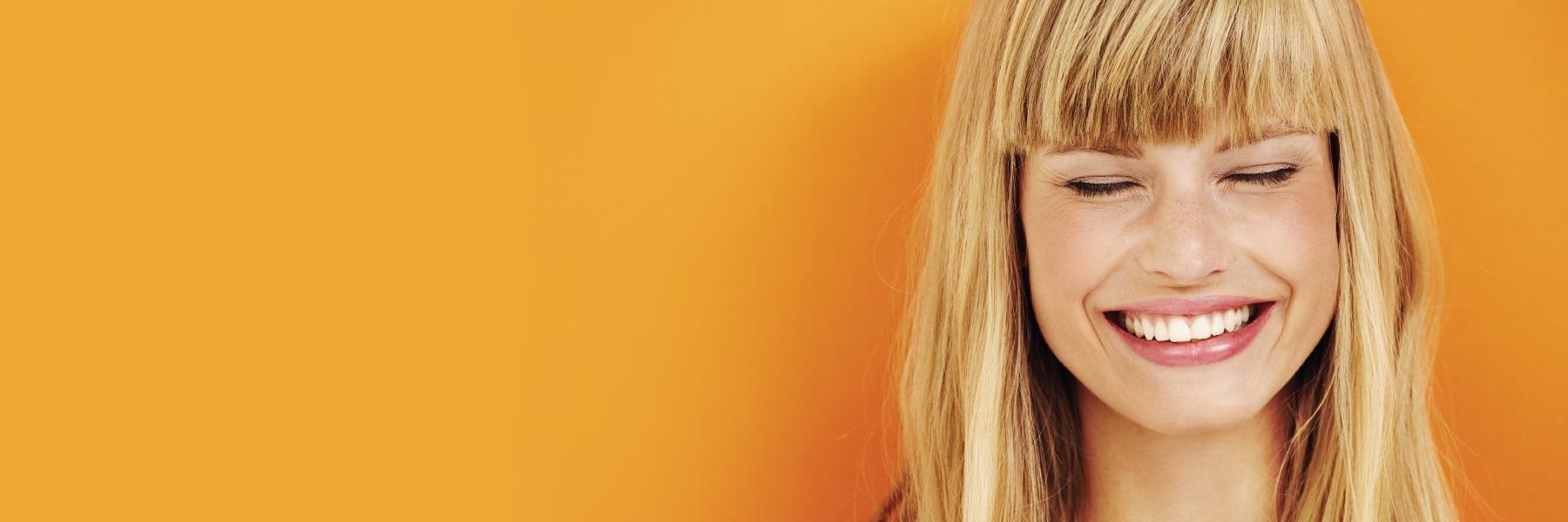 Woman smiling at dentist near me Eagan MN